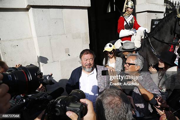 Ai Weiwei and Anish Kapoor depart the Royal Academy as they walk through the city as part of a march in solidarity with migrants currently crossing...