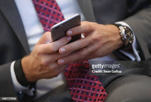 German politician Christian Lindner of the FDP political party uses an Apple iPhone as he attends the Walther Rathenau Award ceremony on September...