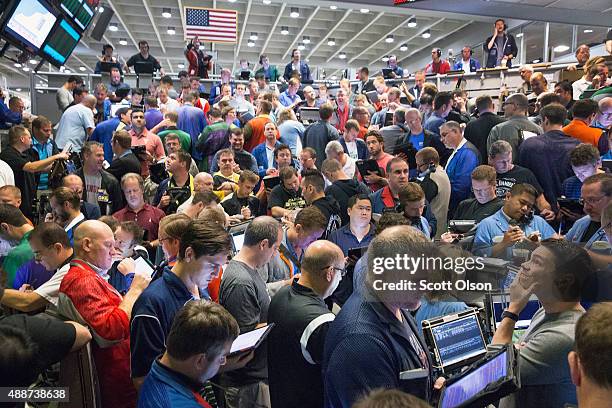 Traders monitor prices in the Standard & Poor's 500 stock index options pit near the open of trade at the Chicago Board Options Exchange on September...