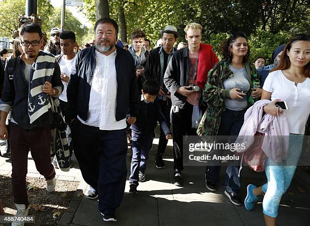Ai Weiwei walks through the city as part of a march in solidarity with migrants currently crossing Europe on September 17, 2015 in London, England....