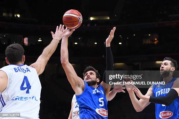 Czech Republic's power forward Petr Benda defends against Italy's small forward Alessandro Gentile during the classification basketball match between...