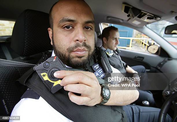 Constable Yasa Amerat and Constable Craig Pearson pictured in their police car wearing body-worn video cameras, ahead of a year-long pilot scheme by...