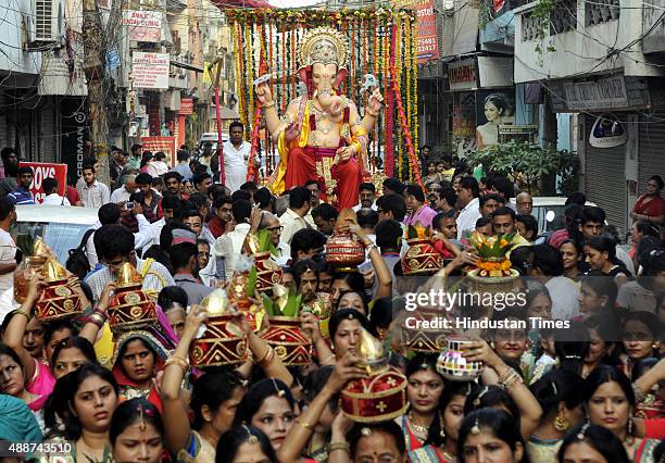 Devotees participate in Shobha Yatra and Mangal Murti Sthapna in Delhi Ka Maharaja, a Ganesh Mahotsav celebration by Ganesh Sewa Mandal in Laxmi...