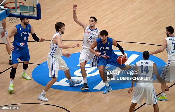 Italy's small forward Alessandro Gentile dribbles his way through Czech Republic's point guard Tomas Satoransky and Czech Republic's small forward...