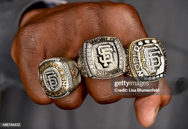 Hensley Meulens of the San Francisco Giants poses for a photograph while wearing his 2010, 2012 and 2014 Giants World Series rings on September 1,...