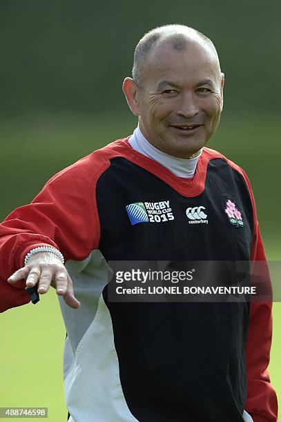 Japan's head coach Eddie Jones watches his players during a team training session at Brighton College in Brighton, on September 17 on the eve of the...