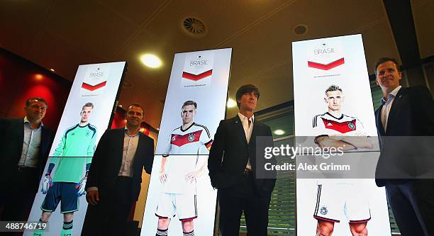 Goalkeeper coach Andreas Koepke, asisstant coach Hans-Dieter Flick, head coach Joachim Loew and team manager Oliver Bierhof pose during the Germany...