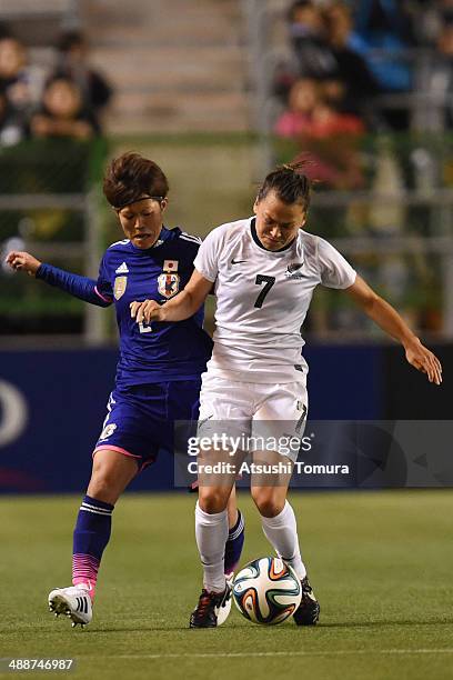 Saori Ariyoshi of Japan and Ali Riley of New Zealand in action during the women's international friendly match between Japan and New Zealand at Nagai...