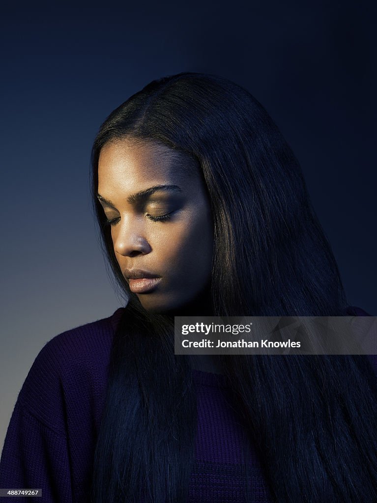 Side portrait of a dark skinned female,eyes closed