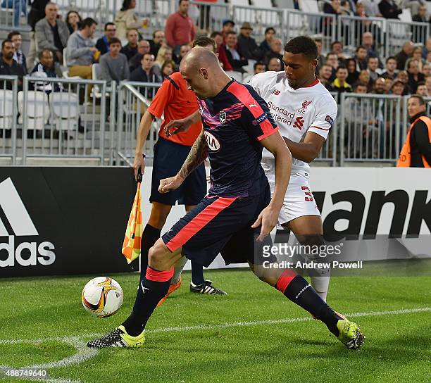 Jordon Ibe of Liverpool competes with Nicolas Pallois of FC Girondins de Bordeaux during the UEFA Europa League match between FC Girondins de...