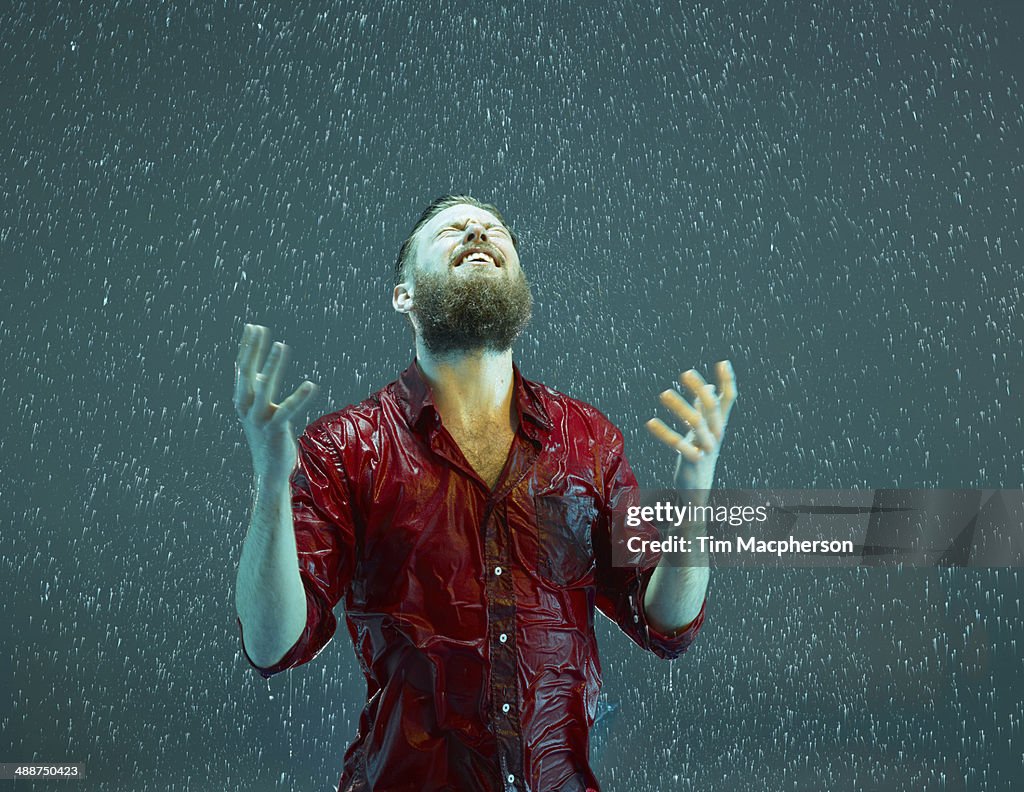 Man smiling in the rain