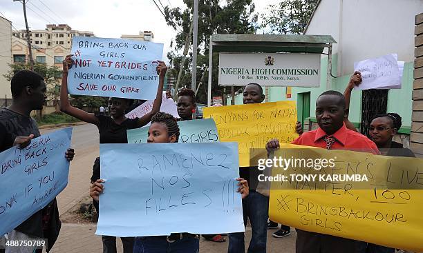 Dozens of people protest on May 8, 2014 in front of the Nigerian High Commission in Nairobi, urging the return of more than 200 schoolgirls abducted...