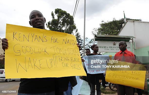 Dozens of people protest on May 8, 2014 in front of the Nigerian High Commission in Nairobi, urging the return of more than 200 schoolgirls abducted...