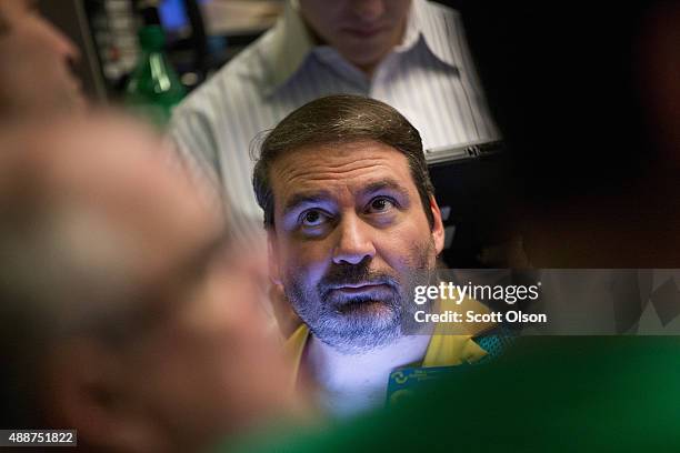 Trader in the Standard & Poor's 500 stock index options pit at the Chicago Board Options Exchange waits for news to break on the Federal Reserve's...