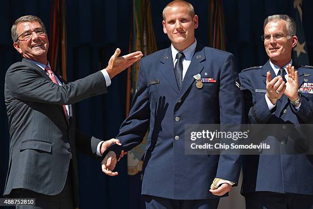 Air Force Airman 1st Class Spencer Stone is congratulated by U.S. Defense Secretary Ashton Carter and Vice Chairman of the Joint Chiefs of Staff Gen....