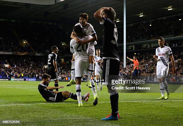 Son Heung-Min of Tottenham Hotspur celebrates scoring their second goal with Dele Alli of Tottenham Hotspur as Badavi Huseynov of FK Qarabag reacts...