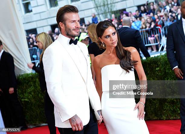 David Beckham and Victoria Beckham attend the "Charles James: Beyond Fashion" Costume Institute Gala at the Metropolitan Museum of Art on May 5, 2014...