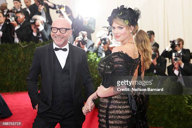 Kate Upton and Domenico Dolce attend the "Charles James: Beyond Fashion" Costume Institute Gala at the Metropolitan Museum of Art on May 5, 2014 in...