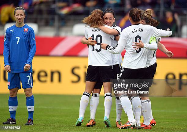 Fatmire Alushi of Grmany celebrates with team mates after scoring his teams first goal during the FIFA Women's World Cup 2015 Qualifier between...