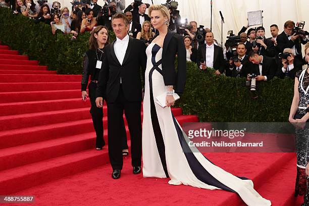 Sean Penn and Charlize Theron attend the "Charles James: Beyond Fashion" Costume Institute Gala at the Metropolitan Museum of Art on May 5, 2014 in...