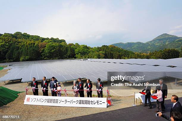 Officials attend the launching ceremony at the SoftBank Ureshino Yoshida Solar Park on May 8, 2014 in Ureshino, Saga, Japan.