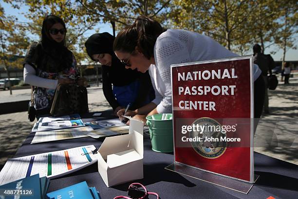 Pakistani immigrant and new American citizen applies for a U.S. Passport following a naturalization ceremony at Liberty State Park on September 17,...