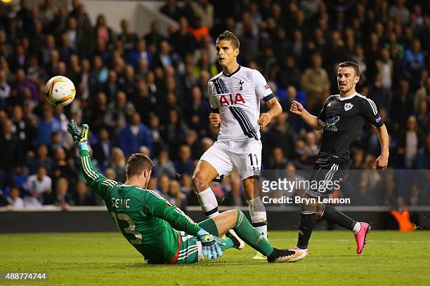 Erik Lamela of Tottenham Hotspur beats goalkeeper Ibrahim Sehic of FK Qarabag to score their third goal during the UEFA Europa League Group J match...