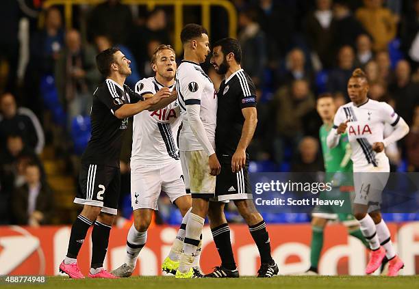 Dele Alli of Tottenham Hotspur squares upto Rashad F. Sadygov of FK Qarabag during the UEFA Europa League Group J match between Tottenham Hotspur FC...