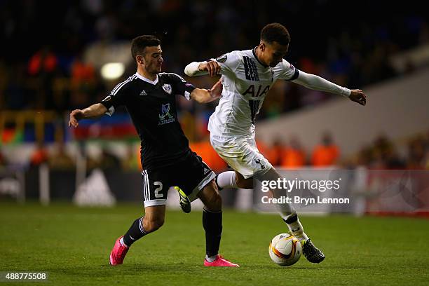 Gara Garayev of FK Qarabag tackles Dele Alli of Tottenham Hotspur during the UEFA Europa League Group J match between Tottenham Hotspur FC and...