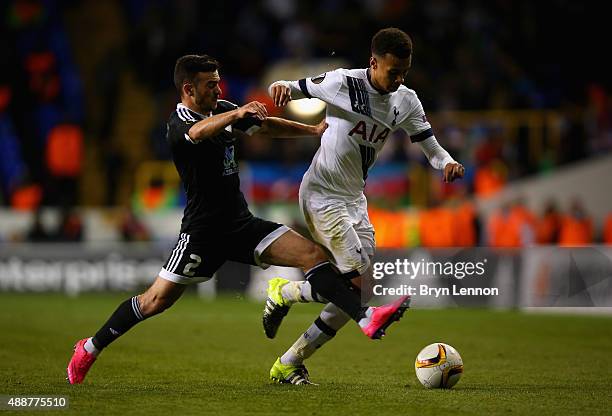 Gara Garayev of FK Qarabag tackles Dele Alli of Tottenham Hotspur during the UEFA Europa League Group J match between Tottenham Hotspur FC and...