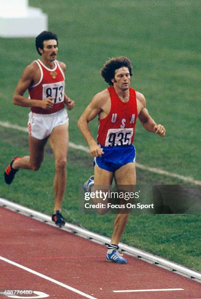 Decathlete Bruce Jenner runs in the 1,500 meter run of the decathlon during the 1976 Summer Olympic Games at Olympic Stadium in Montreal, Quebec....