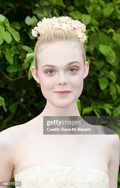 Elle Fanning arrives at a private reception as costumes and props from Disney's "Maleficent" are exhibited in support of Great Ormond Street Hospital...