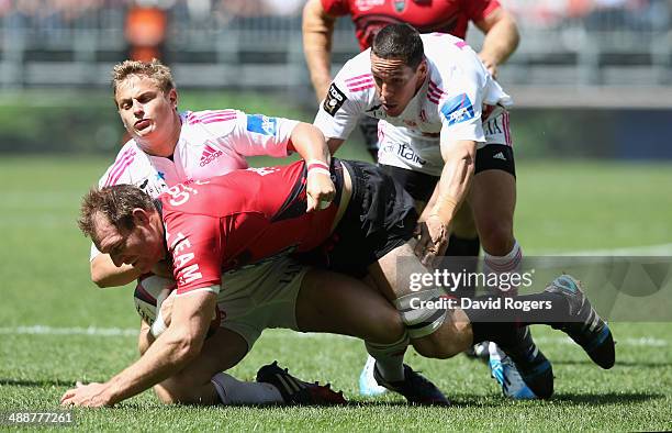 Ali Williams of Toulon is tackled by Jules Plisson and Julien Arias during the Top 14 match between Toulon and Stade Francais at the Allianz Riviera...