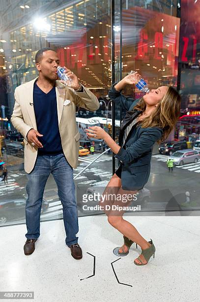 Calloway interviews Chrissy Teigen during her visit to "Extra" at their New York studios at H&M in Times Square on May 8, 2014 in New York City.