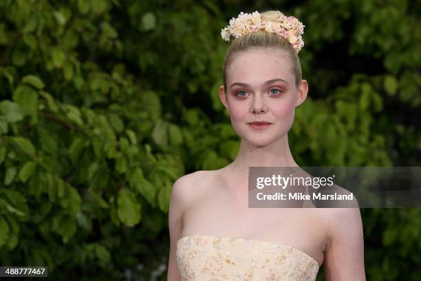 Elle Fanning attends a private reception as costumes and props from Disney's "Maleficent" are exhibited in support of Great Ormond Street Hospital at...