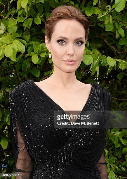 Angelina Jolie arrives at a private reception as costumes and props from Disney's "Maleficent" are exhibited in support of Great Ormond Street...