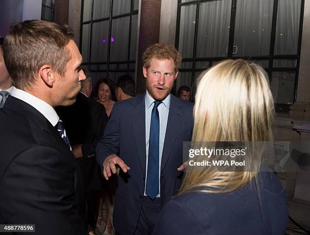 Prince Harry speaks with Jonny Wilkinson at the Rugby World Cup 2015 welcome party hosted by the Rugby Football Union at Durbar Court, The Foreign...