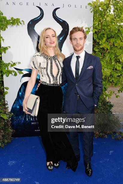 Ruta Gedmintas and Luke Treadaway arrive at a private reception as costumes and props from Disney's "Maleficent" are exhibited in support of Great...