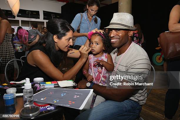 Tiki Barber and daughter Brooklyn Barber attend the purple carpet premiere screening of the My Little Pony Equestria Girls Friendship Games animated...