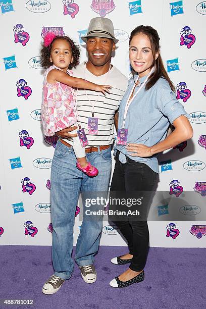 Tiki Barber and Traci Lynn Johnson arrive with daughter at the My Little Pony Equestria Girls Friendship Games premiere September 17, 2015 at the...