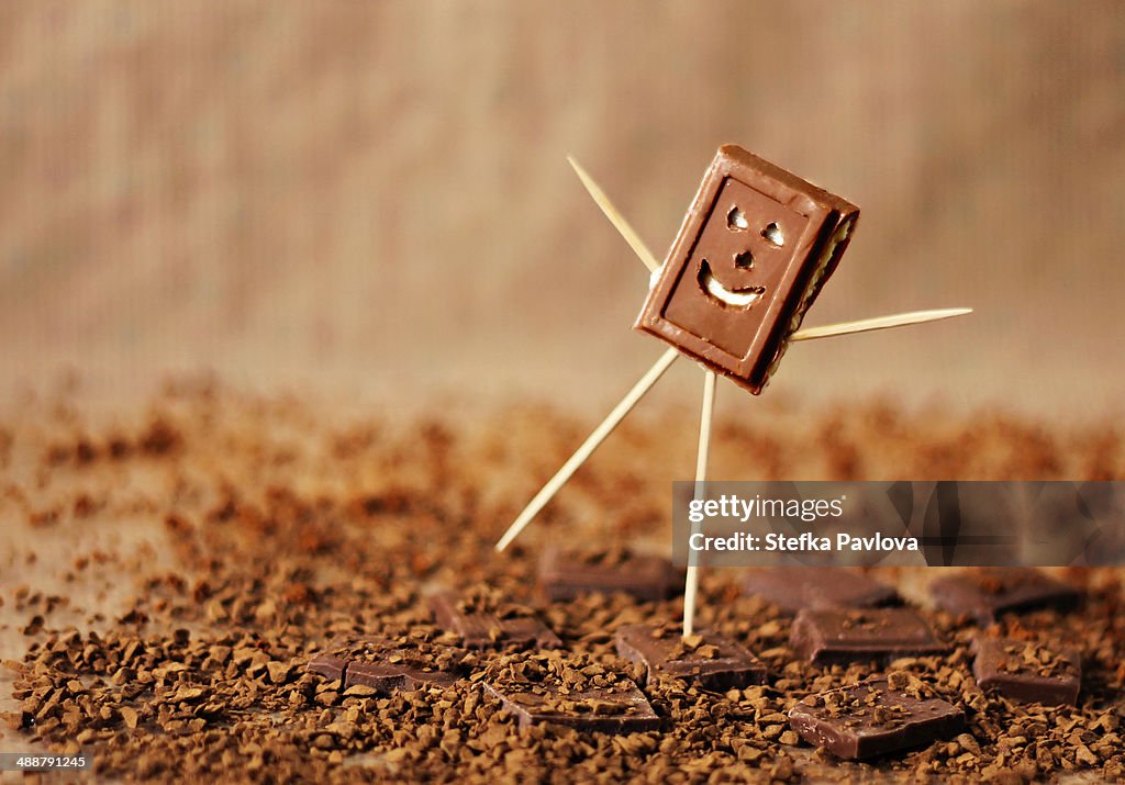 Happy man made of chocolate bar and sticks
