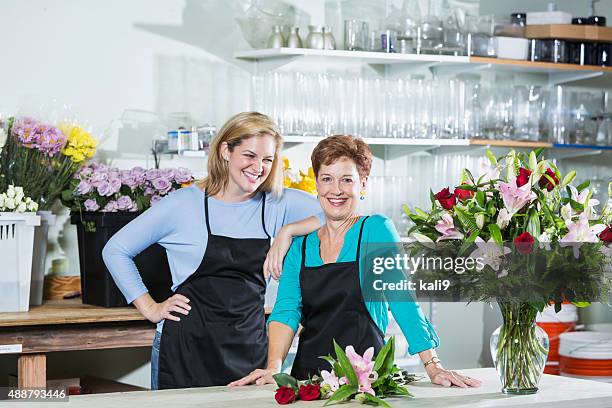 two women working in a flower shop wearing aprons - kali rose stock pictures, royalty-free photos & images