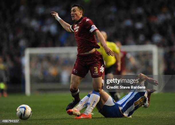 Craig Forsyth of Derby County is tackled by Inigo Calderon of Brighton & Hove Albion during the Sky Bet Championship Play Off semi final first leg...