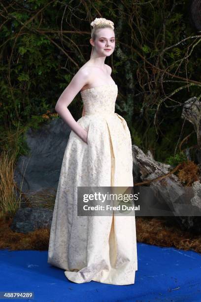 Elle Fanning attends a private reception as costumes and props from Disney's "Maleficent" are exhibited in support of Great Ormond Street Hospital at...