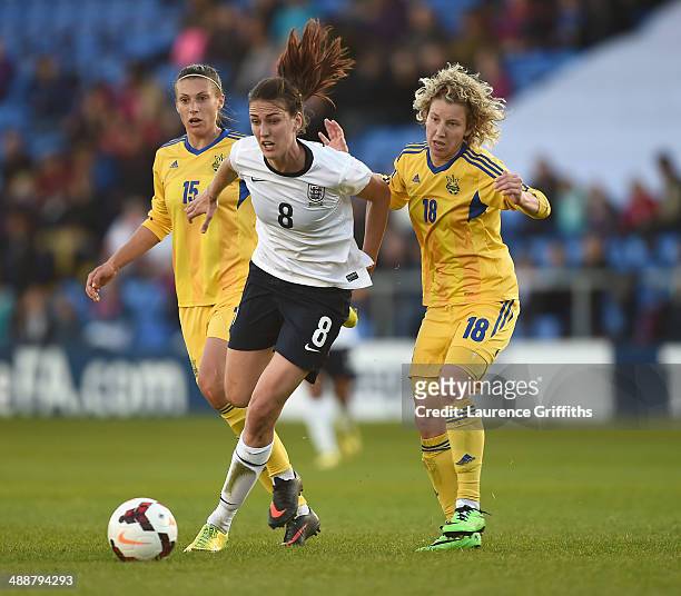 Jill Scott of England battles with Iryna Vasylyuk and Iya Andrushchak of Ukraine during the Women's World Cup Group Six Qulifier between England and...