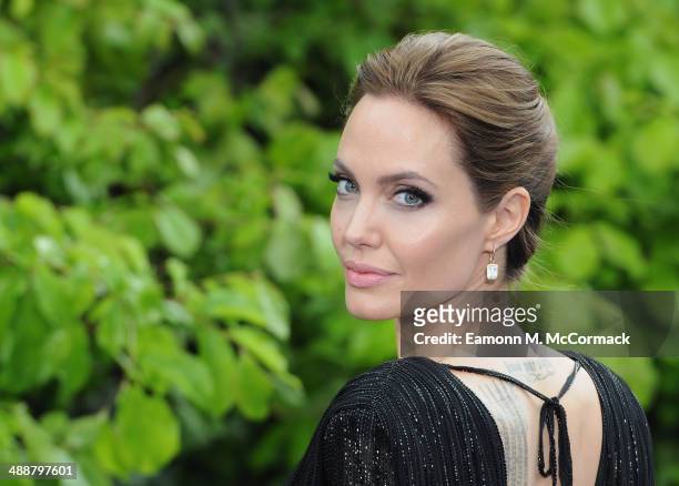 Angelina Jolie attends a private reception as costumes and props from Disney's "Maleficent" are exhibited in support of Great Ormond Street Hospital...