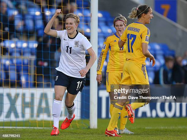 Natasha Dowie of England celebrates scoring the third goal during FIFA Women's World Cup Qualifier between England and Ukraine at the Greenhous...