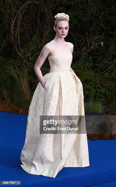 Elle Fanning attends a private reception as costumes and props from Disney's "Maleficent" are exhibited in support of Great Ormond Street Hospital at...