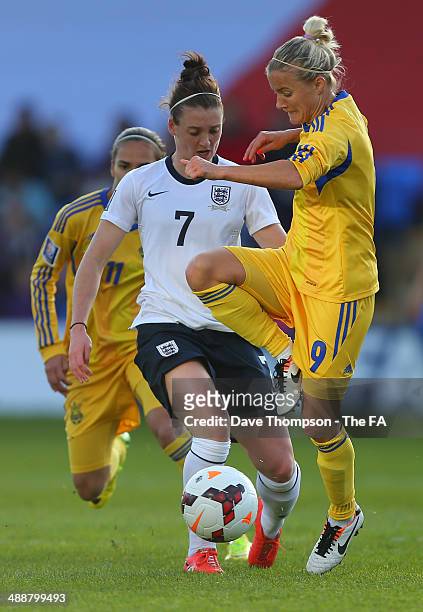 Jade Moore of England tackles Vira Diatel of Ukraine during the FIFA Women's World Cup Qualifier between England and Ukraine at the Greenhous Meadow...