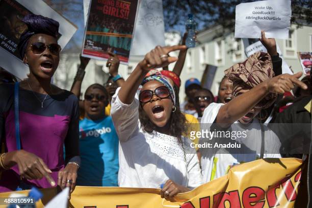 Hundreds of people gather outside the Nigerian Consulate in Rivonia, Johannesburg, on May 8, 2014 during a protest against the Nigerian government's...